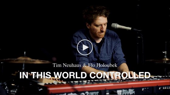 Tim Neuhaus & Flo Holoubek – In This World Controlled (feat. Iris Romen)